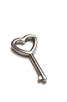 Heart shaped key isolated photo