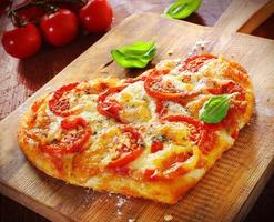 Heart shaped vegetarian pizza photo
