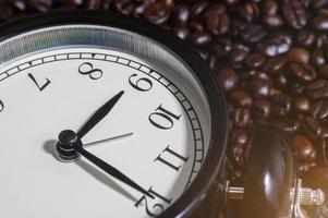Clock on coffee beans photo