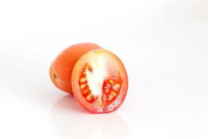 Fresh tomatoes on white background photo