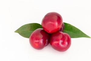 Fresh red cherry plum on white background photo