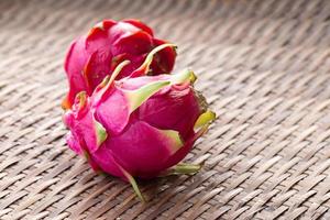 Fresh pitahaya fruit on wooden background  photo