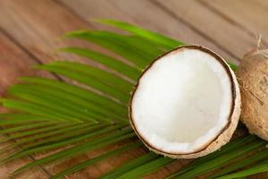 Close up of coconut on wooden background photo