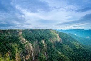 Cliffs with waterfalls in the mountains photo