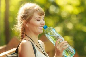 Tourist woman with water bottle outdoor photo