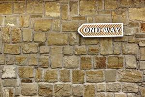 One Way Arrow on Old Stone Wall