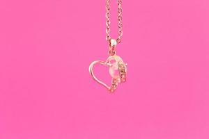 Gold heart on a chain photo