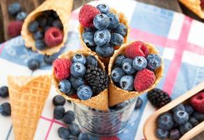 Fresh berries in waffle cone