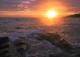 Beautiful sunset and sea waves photo
