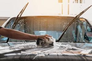 Washing the hood of a car photo