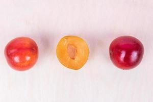 Red and yellow plum fruits photo