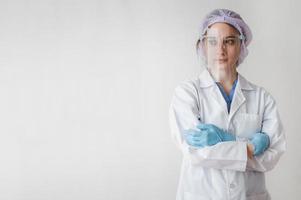 Female doctor wearing protective ppe gear photo