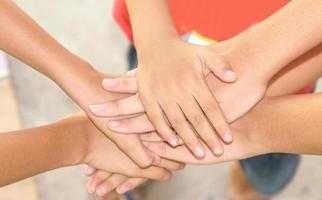 Joining hands for team work photo