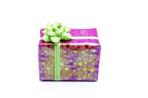 pink gift box with green ribbon bow photo