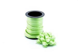 green satin gift bow. Ribbon. Isolated on white