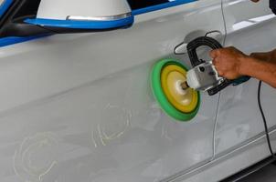 Man polishing car photo