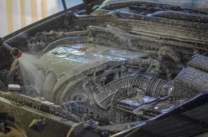 Car engine wash with foam photo
