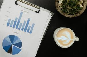 Top view of business documents and coffee mug photo