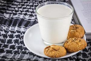 Milk, cookie and book photo