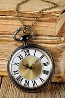 Antique watch and books photo