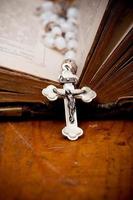 silver crucifix on ancient bible, photo