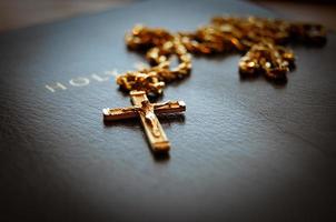 Holy bible with cross photo
