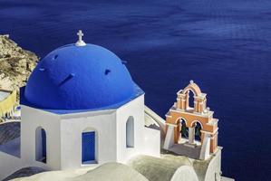 Santorini scene with famous blue dome churches, Greece photo