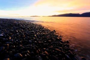 Twilight:An island of smooth polished rocks photo