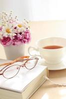 glasses on book and tea