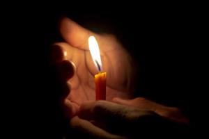 Man holding a candle photo