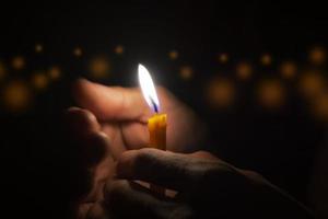 Man holding a candle photo