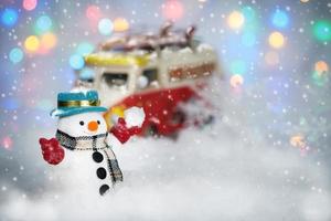 A snowman playing on bokeh background photo