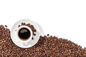 Cup of espresso coffee and roasted beans on white background photo