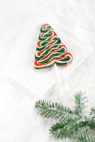 christmas tree lolly on a festive snow background photo