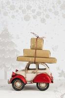 Christmas holiday card with gift boxes on toy car