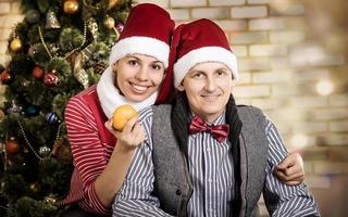 young couple in Santa caps. photo