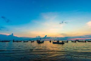 Sunset in the sea of Tao island with boat photo