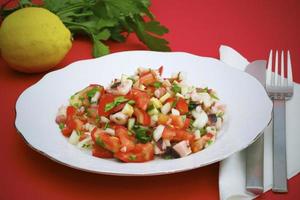 Octopus salad with tomatoes and parsley