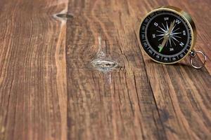 Gold Compass On Wood Background