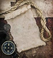 old compass and rope on grunge background photo