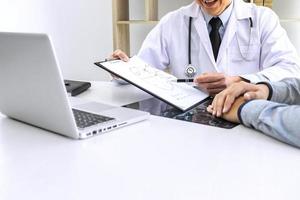 Doctor explaining diagnosis to the patient photo
