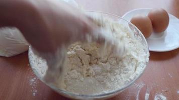 Preparing Dough, hands mixing ingredients. video