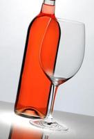 Wine glass in front of bottle