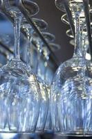 Upturned wine glasses in restaurant bar close-up photo