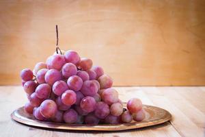 pink grapes on a metal tray