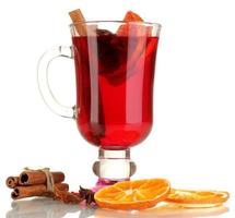 Fragrant mulled wine in glass isolated on white
