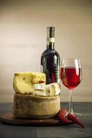 Wine and different cheese photo