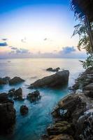 Rocks, sea, sunset on the Tropical beach in Koh Phangan