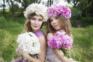 Two girls with rose peony wreath