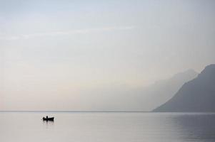 Lone Boat in the Lake Garda photo